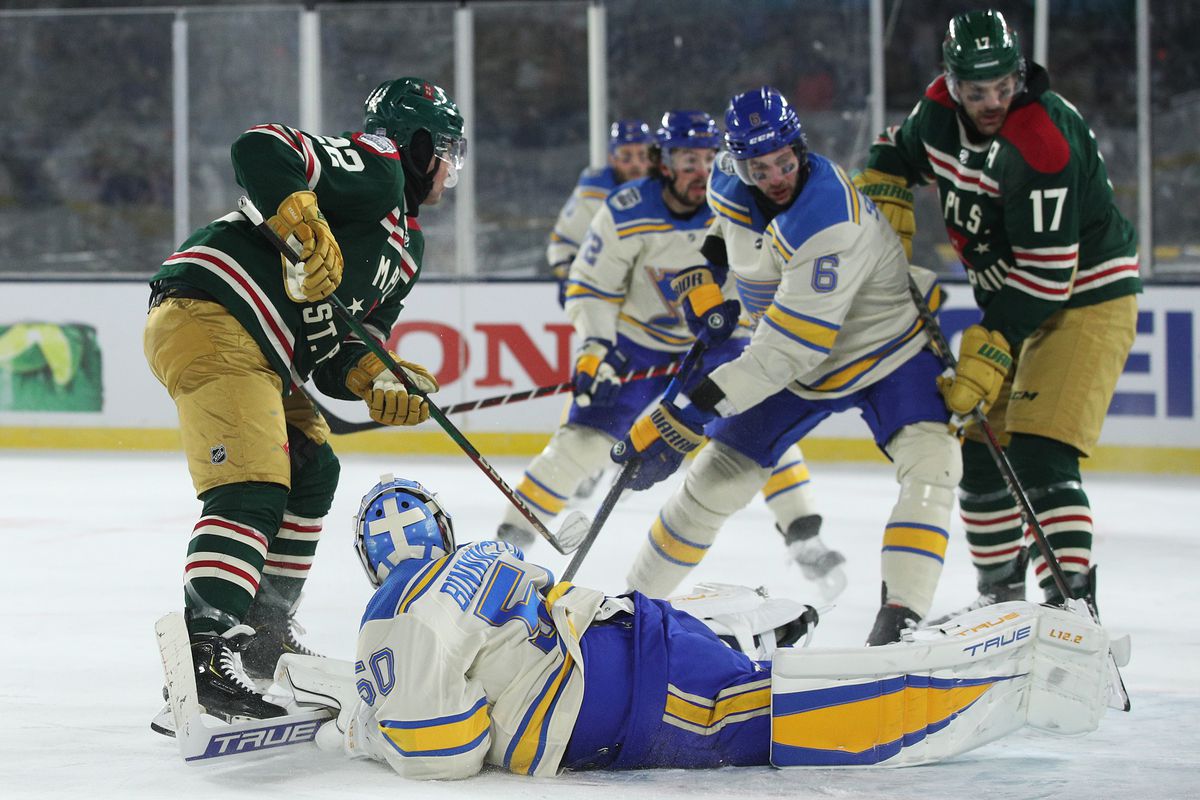 Jordan Binnington #50 of the St. Louis Blues defends the goal as Kevin Fiala #22 of the Minnesota Wild scores a goal in the third period during the NHL Winter Classic at Target Field on January 01, 2022 in Minneapolis, Minnesota.