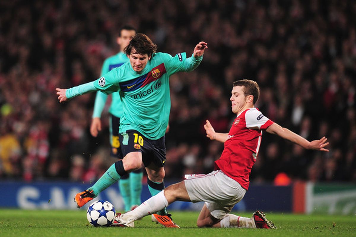 Jack Wilshere challenges Leo Messi, epitomizing Arsenal's defensive system on Wednesday 