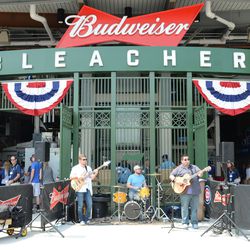 11:49 a.m. Band playing for the bleacher grand opening - 