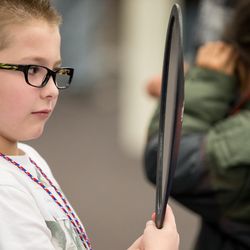 Colton Walker, 6, tries on a pair of glasses during SightFest at the Jordan School District Auxiliary Services building in West Jordan on Thursday, Dec. 8, 2016. SightFest is a partnership between Friends for Sight and the Utah Optometric Association that on Thursday provided free eye exams and glasses for 125 students from Title I schools in the Jordan School District.