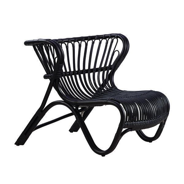 A black, curved chair that’s low to the ground.