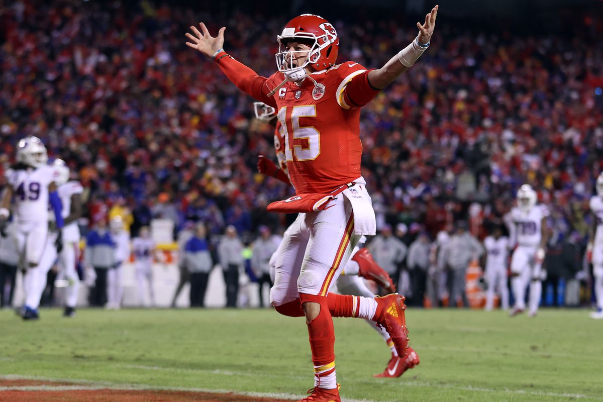 Patrick Mahomes #15 of the Kansas City Chiefs celebrates a touchdown scored by Tyreek Hill #10 against the Buffalo Bills during the fourth quarter in the AFC Divisional Playoff game at Arrowhead Stadium on January 23, 2022 in Kansas City, Missouri.