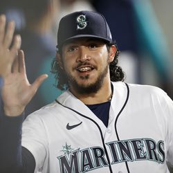 Andres Munoz #75 of the Seattle Mariners reacts during the eighth inning against the Texas Rangers