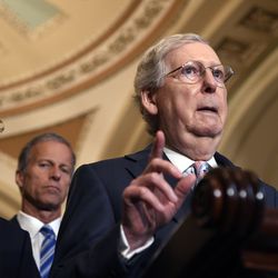 Senate Majority Leader Mitch McConnell of Ky., right, joined by Sen. John Barrasso, R-Wyo., left, and Sen John Thune, R-S.D., center, speaks to reporters following the weekly policy lunches on Capitol Hill in Washington, Tuesday, July 23, 2019. (AP Photo/Susan Walsh)