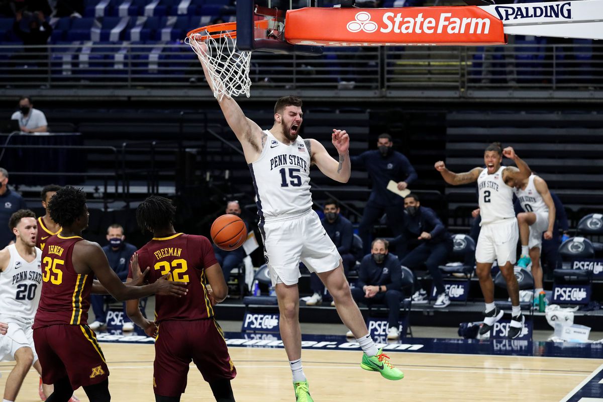 Trent Buttrick (15) reacts after dunking the ball during the second half against the Minnesota Golden Gophers at Bryce Jordan Center
