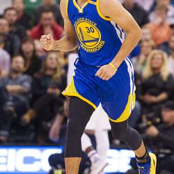 Golden State guard Stephen Curry (30) pumps his fist after a made basket during the first half of an NBA basketball game against Utah in Salt Lake City on Thursday, Dec. 8, 2016.