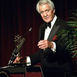 FILE - In this April 19, 1994, file photo, Pat Summerall, completing his 34th and final season with CBS, receives an award for lifetime achievement at the 1994 Sports Emmy Awards in New York. Fox Sports spokesman Dan Bell said Tuesday, April 16, 2013, that Summerall, the NFL player-turned-broadcaster whose deep, resonant voice called games for more than 40 years, has died at the age of 82. (AP Photo/Rob Clark, File)