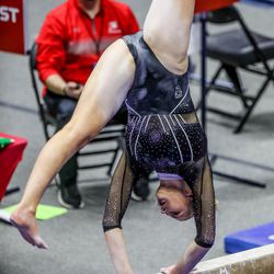Utah’s Lucy Stanhope performs on the bars as Utah and UCLA compete in a gymnastics meet at the Huntsman Center in Salt Lake City on Friday, Feb. 19, 2021.
