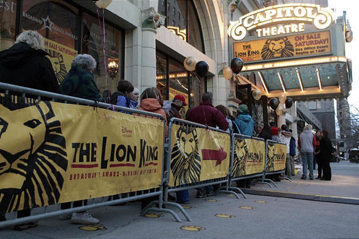 "Lion King" fans wait in line to buy tickets to the touring production of the Tony Award-winning musical at Capitol Theatre Saturday. Carol Sanders of Layton was the first person in line, having staked her position at 9:45 p.m. Friday night. Due to popula