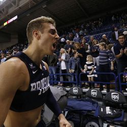 BYU's Chase Fischer celebrates after winning an NCAA college basketball game against Gonzaga, Thursday, Jan. 14, 2016, in Spokane, Wash. BYU won 69-68. (AP Photo/Young Kwak)