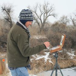 Latter-day Saint artist John Burton paints outdoors along the Mormon Trail. His works are part of a new exhibition at the Church History Museum