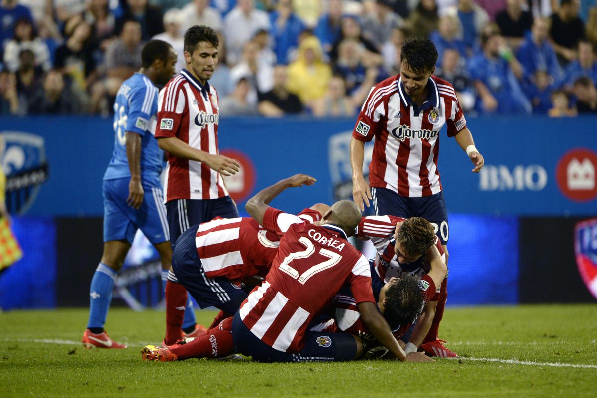 Chivas players trying to hold Eric Avila down for that slap he needs. or celebrating a goal. One or the other. 