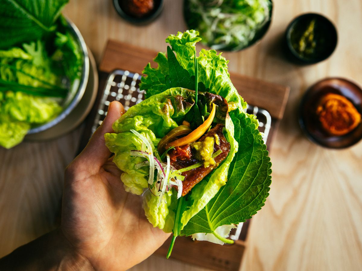 Korean barbecue in a lettuce leaf at San Ho Won