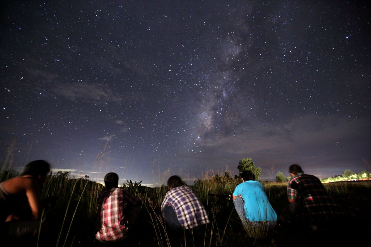 People gather to watch the 2013 Perseid meteor shower in Myanmar. 