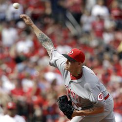 Cincinnati Reds starting pitcher Mat Latos throws during the first inning of a baseball game against the St. Louis Cardinals Monday, April 8, 2013, in St. Louis. (AP Photo/Jeff Roberson)
