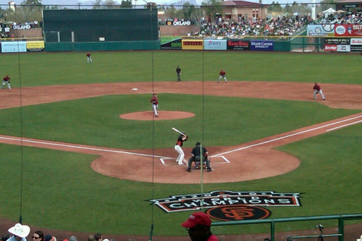 First pitch by Joe Saunders this afternoon at Scottsdale Stadium. I cropped it so you couldn't see the unsightly logo on the grass just behind home-plate. [Pic courtesy of the Arizona Diamondbacks]