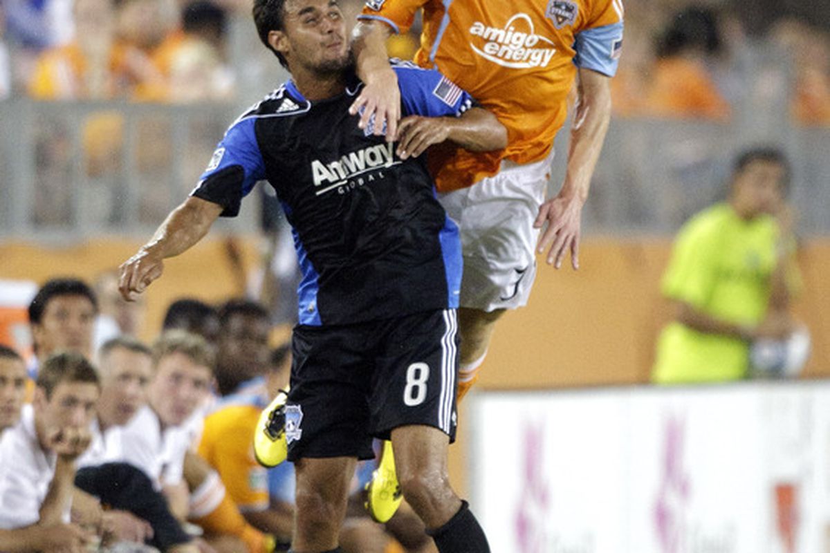 HOUSTON - SEPTEMBER 05:  Andrew Hainult #31 of the Houston Dynamo goes over the top of Chris Wodolowski #8 of the San Jose Earthquakes for a header at Robertson Stadium  on September 5 2010 in Houston Texas.  (Photo by Bob Levey/Getty Images)