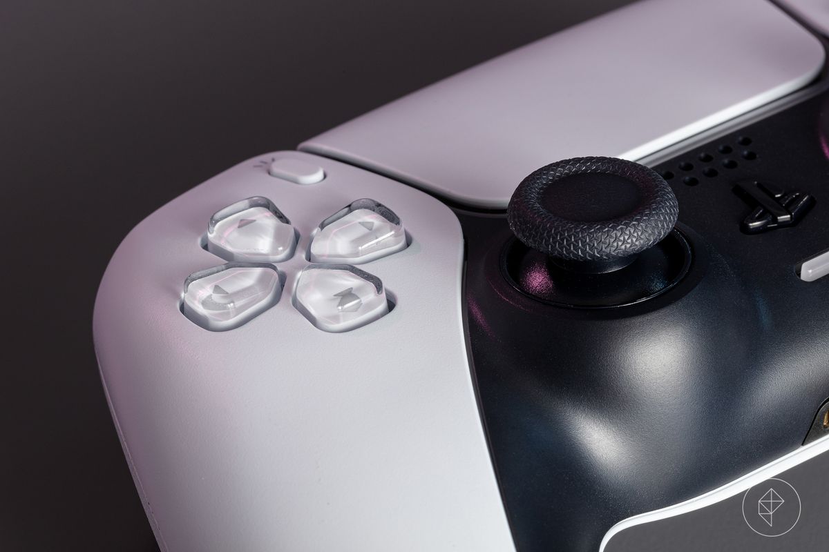 a close-up of the D-pad and left analog stick of the PS5’s DualSense controller
