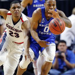 Brigham Young Cougars guard Jahshire Hardnett pulls in a loose ball with Gonzaga Bulldogs guard Zach Norvell Jr. at left during the West Coast Conference championship game in Las Vegas on Tuesday, March 6, 2018.