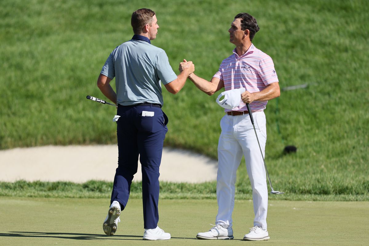 Luke List of the United States and Billy Horschel of the United States shake hands on the 18th green during the third round of the Memorial Tournament presented by Workday at Muirfield Village Golf Club on June 04, 2022 in Dublin, Ohio.