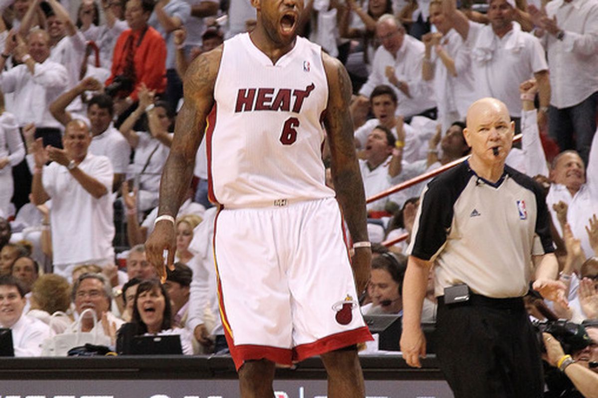 Lets see here...LeBron James and Heat fans celebrating.  Joey Crawford looking upset.  Nope, nothing wrong with this picture.  (side note: look how happy the guy to the right of Crawford looks)