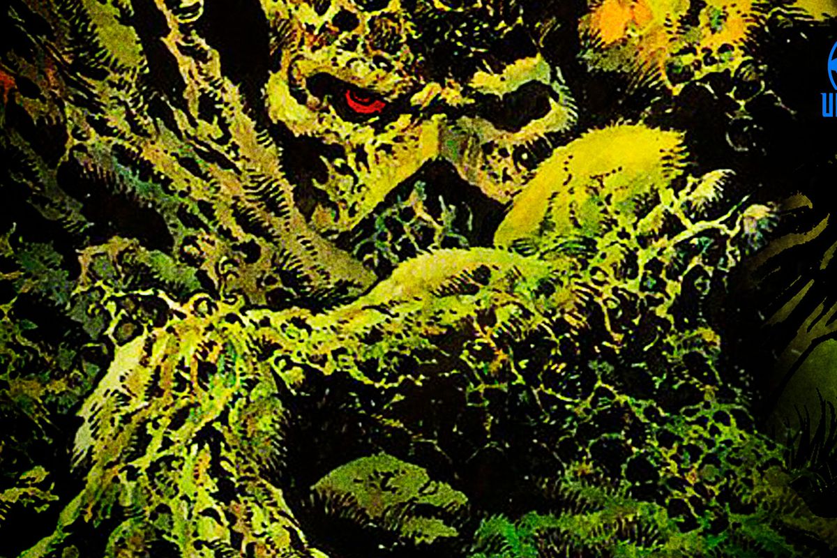 Swamp Thing covered in moss, with red eyes peaking out