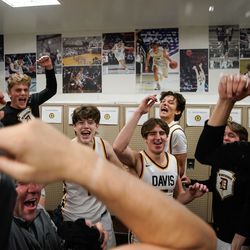 Davis High players cheer after winning the Northern Utah Shootout championship game against Olympus at Davis High School in Kaysville on Saturday, Dec. 11, 2021.