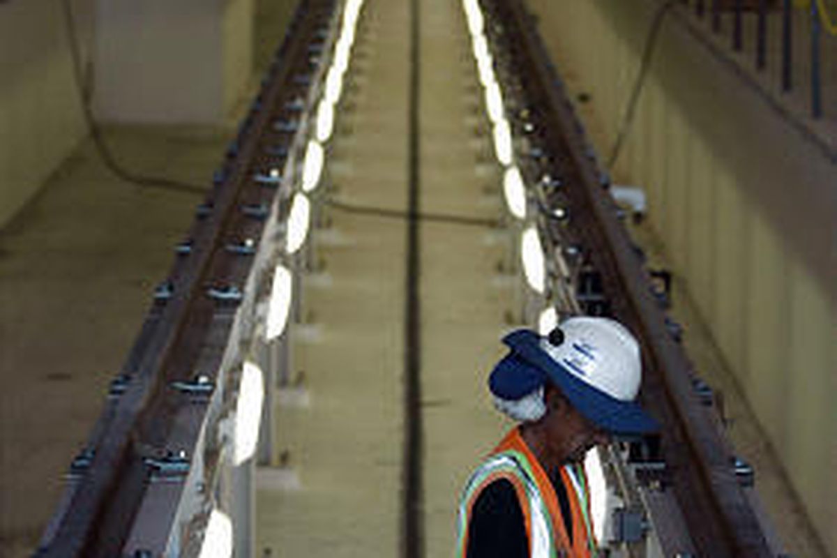 Workers put finishing touches on a maintenance facility to service TRAX trains in South Salt Lake.