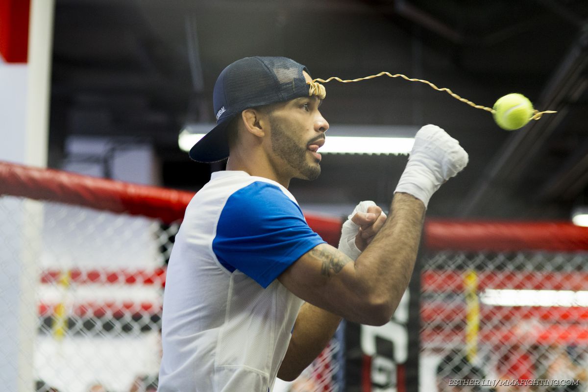 Rob Font warms up with a tennis-ball exercise at the UFC Fight Night 81 open workouts in Boston. 