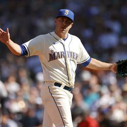 SEATTLE, WASHINGTON - AUGUST 28: Pitcher Erik Swanson #50 of the Seattle Mariners reacts after getting a strike out against the Cleveland Guardians in the eighth inning at T-Mobile Park on August 28, 2022 in Seattle, Washington.