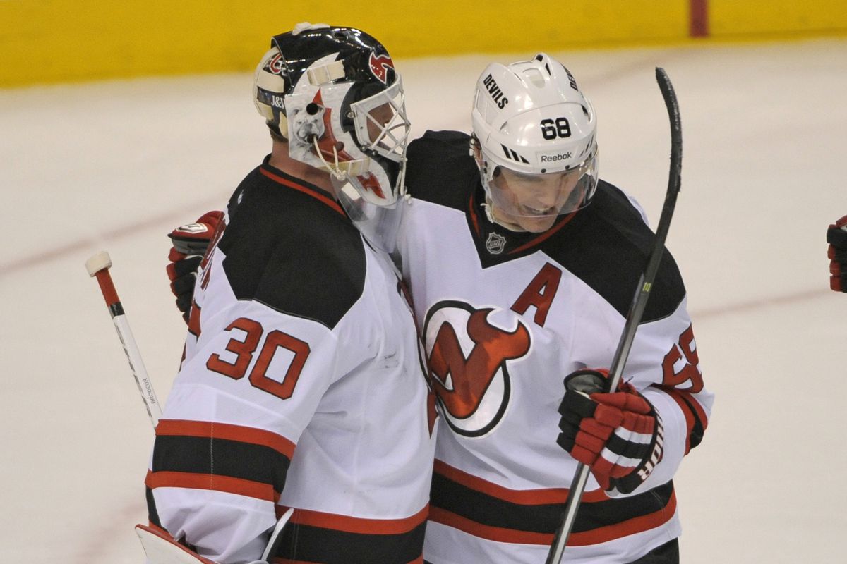 Martin Brodeur gets a congratulatory hug from Jaromir Jagr for his first shutout of the season, in the best month he would have all season: November 2013.