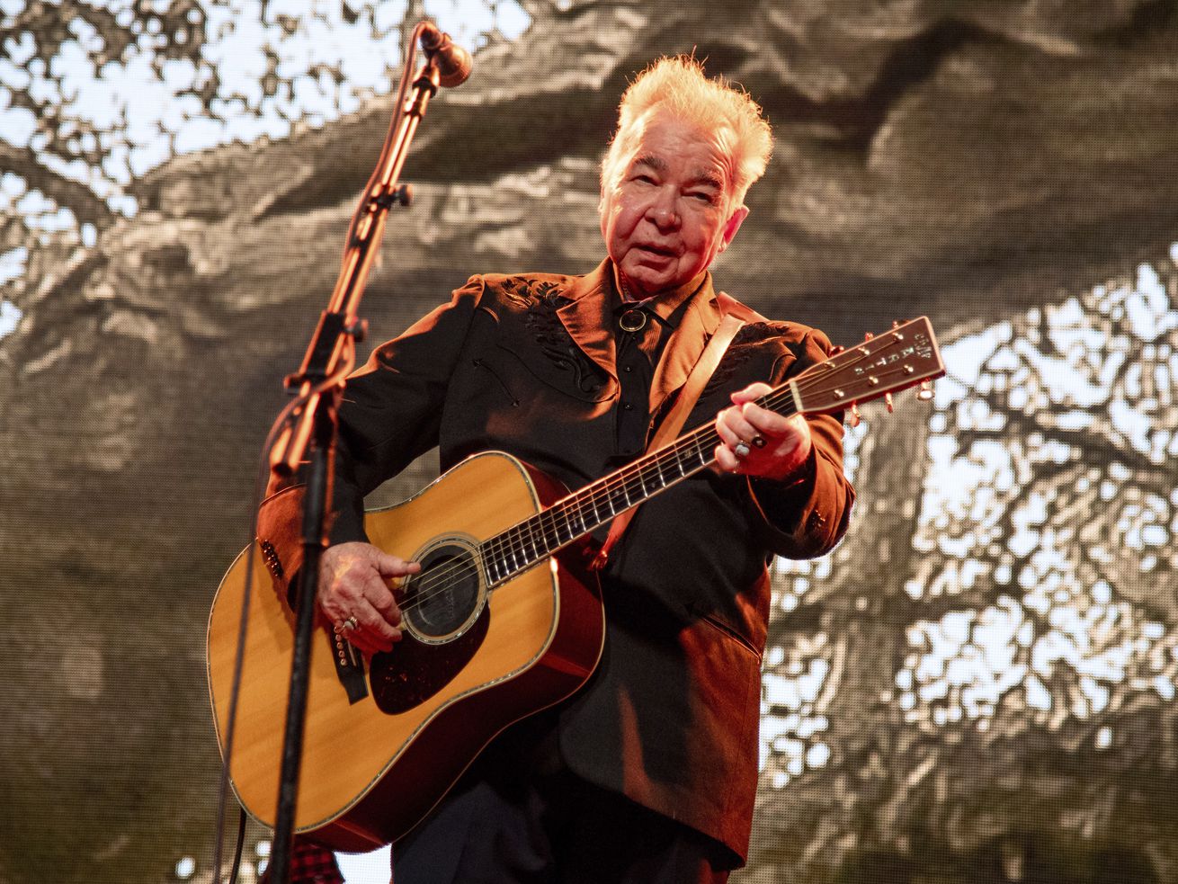 This June 15, 2019 file photo shows John Prine performing at the Bonnaroo Music and Arts Festival in Manchester, Tenn.