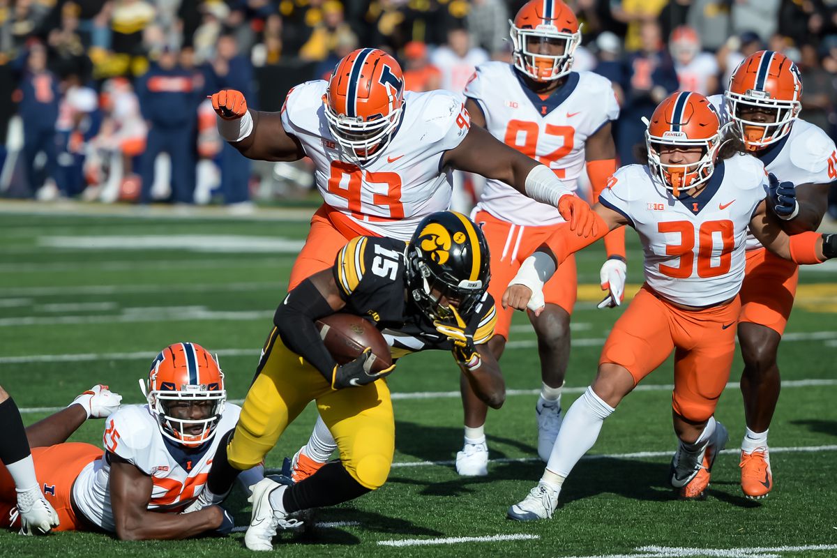 Illinois Fighting Illini defensive back Kerby Joseph (25) tackles Iowa Hawkeyes running back Tyler Goodson (15) near the goal line in the first half at Kinnick Stadium.