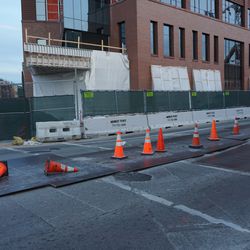 Metal plates and traffic cones protecting what I heard was a water main break, on Clark Street at Waveland Avenue