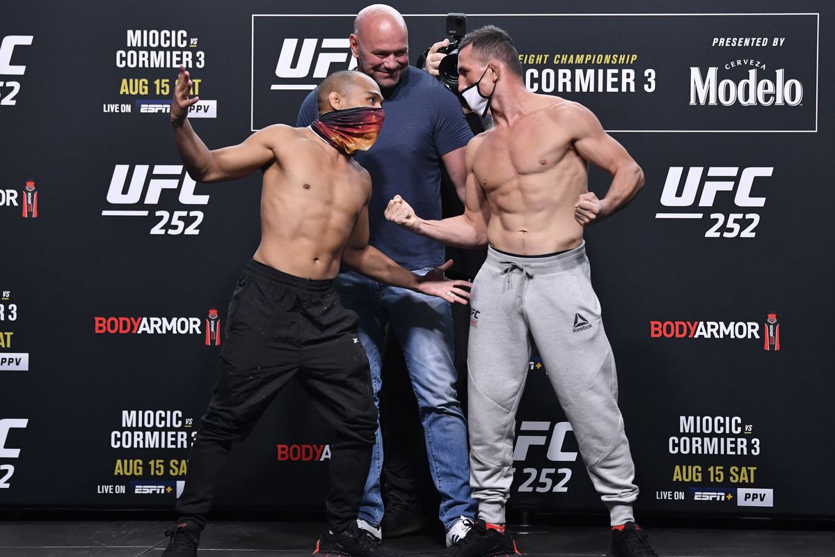 Opponents John Dodson and Merab Dvalishvili of Georgia face off during the UFC 252 weigh-in at UFC APEX on August 14, 2020 in Las Vegas, Nevada.