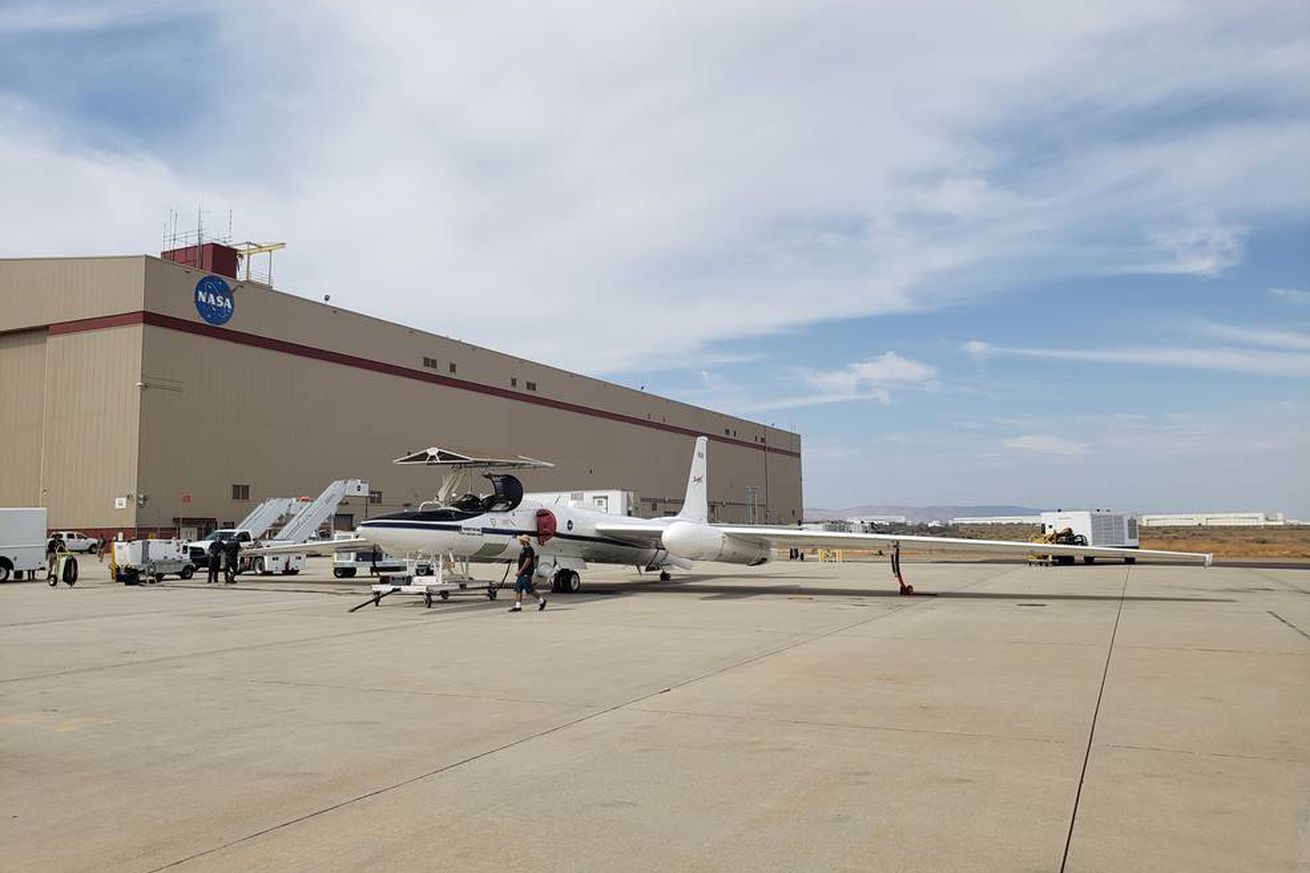 The ER-2 high-altitude aircraft parked outside of a NASA building.