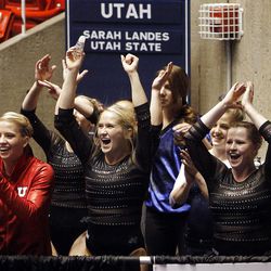 Utah's gymnastics team cheers during the floor exercise at the NCAA Salt Lake Regional Gymnastics meet on Saturday in Salt Lake City.  