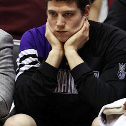 Jimmer Fredette  of Sacramento watches from the bench as the Sacramento Kings face the Utah Jazz in NBA basketball in Salt Lake City, Friday, March 30, 2012.
