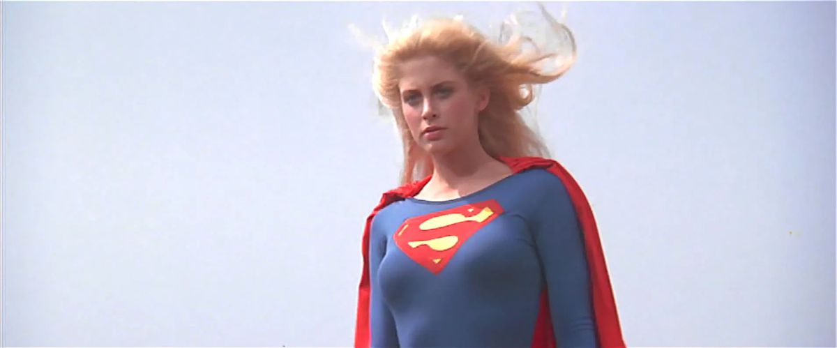 Helen Slater as Supergirl, blonde hair billowing in the breeze, in Supergirl (1984).