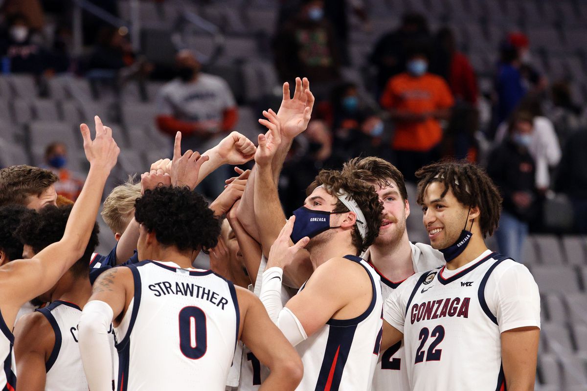 The Gonzaga Bulldogs celebrate a 98-75 win against the Virginia Cavaliers at Dickies Arena on December 26, 2020 in Fort Worth, Texas.