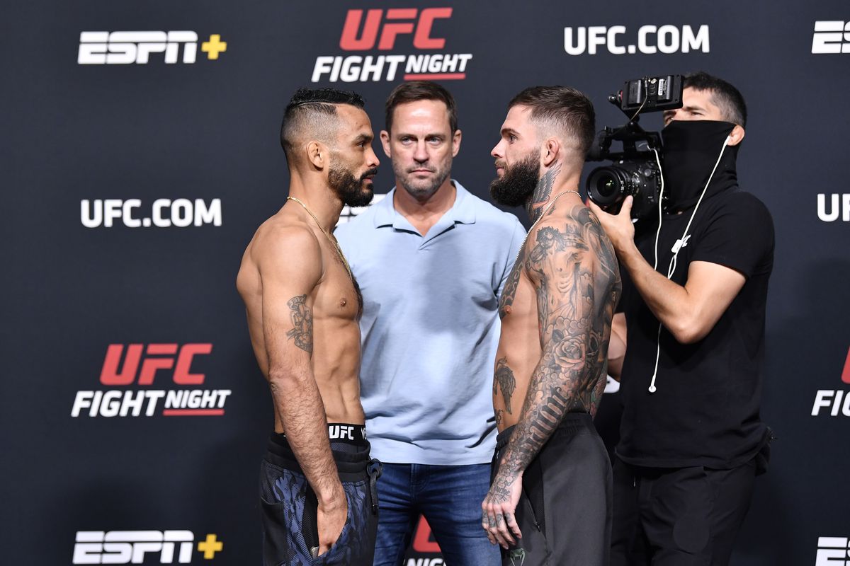 In this UFC handout, Rob Font and Cody Garbrandt face off during the UFC Fight Night weigh-in at UFC APEX on May 21, 2021 in Las Vegas, Nevada.