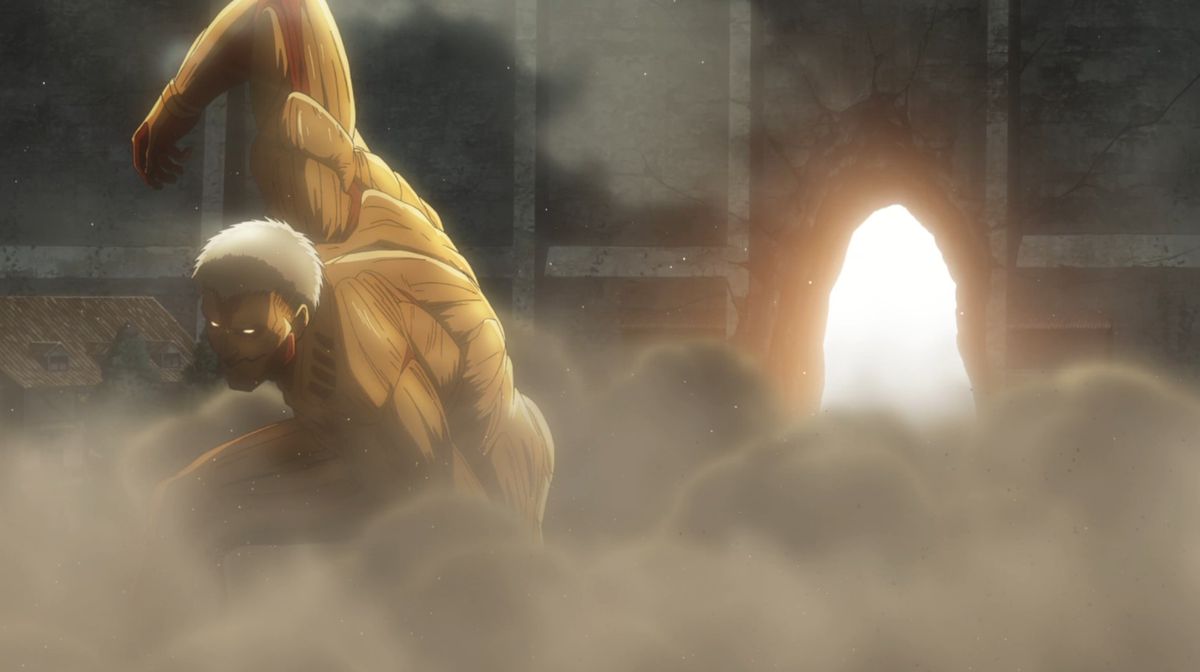 A colossal “Armored Titan” kneeling in a cloud of smoke in front of the a gaping hole in a massive wall in Attack on Titan.