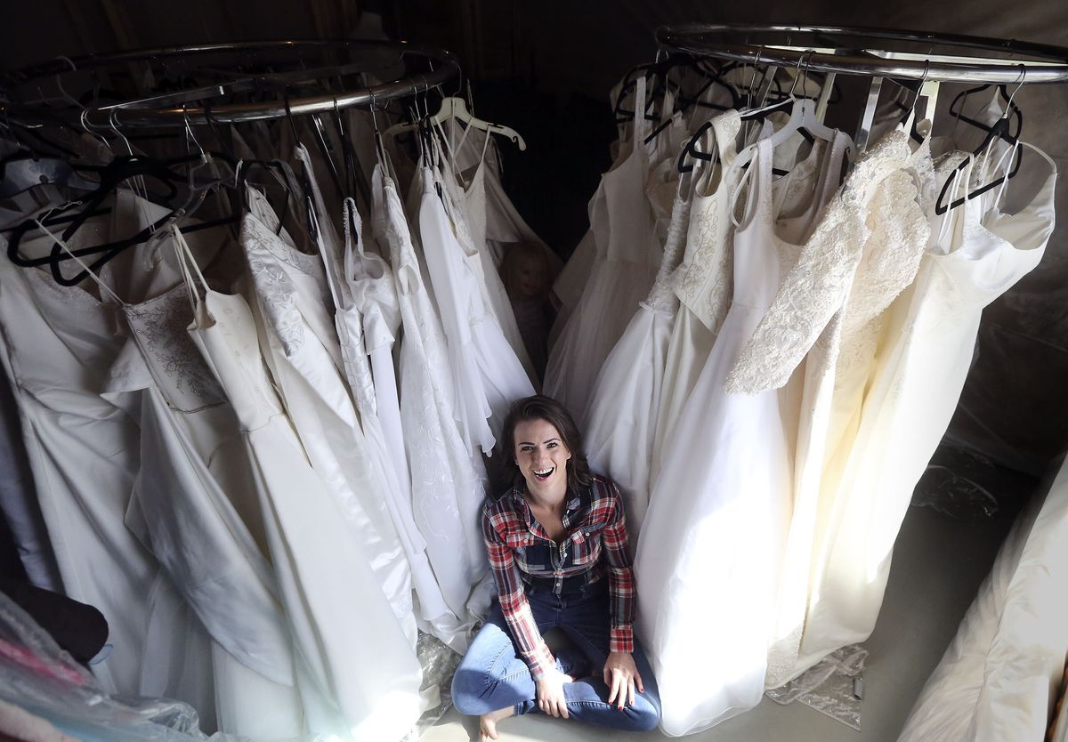 Rebecca Rees, who has 50 wedding dresses she wants to give away to single mothers, poses for a portrait at her home in Bluffdale on Tuesday, Sept. 17, 2019.