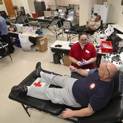 Madison Esmay, American Red Cross collection specialist, talks with Jim Vesock as she prepares to draw his blood during a blood drive at the Salt Lake County Jail in South Salt Lake on Monday, Sept. 30, 2019. The Salt Lake County Sheriff’s Office and the Unified Police Department teamed with the American Red Cross for the event.