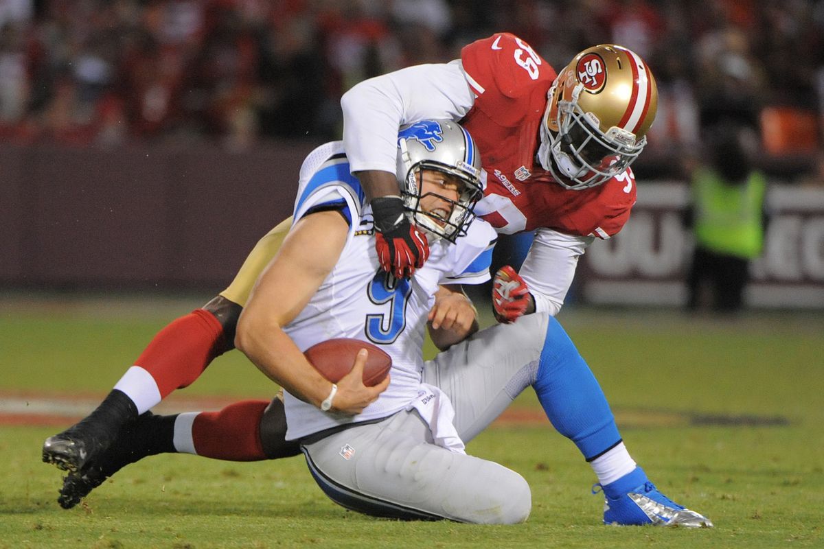September 16, 2012; San Francisco, CA, USA; Detroit Lions quarterback Matthew Stafford (9) is sacked by San Francisco 49ers outside linebacker Aldon Smith (99) during the fourth quarter at Candlestick Park. Mandatory Credit: Kyle Terada-US PRESSWIRE