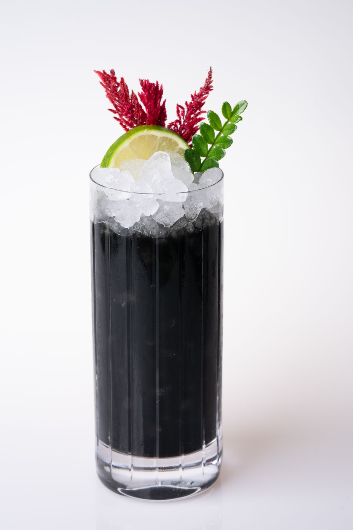 A black tropical cocktail.