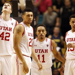 Members of the Utah Utes break from a huddle during the overtime period of a Pac-12 conference tournament semifinal against the Cal Bears at the MGM Grand Garden Arena in Las Vegas, Friday, March 11, 2016.