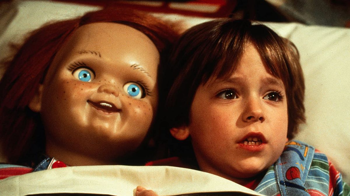 Andy (Alex Vincent) tucked into bed with Chucky