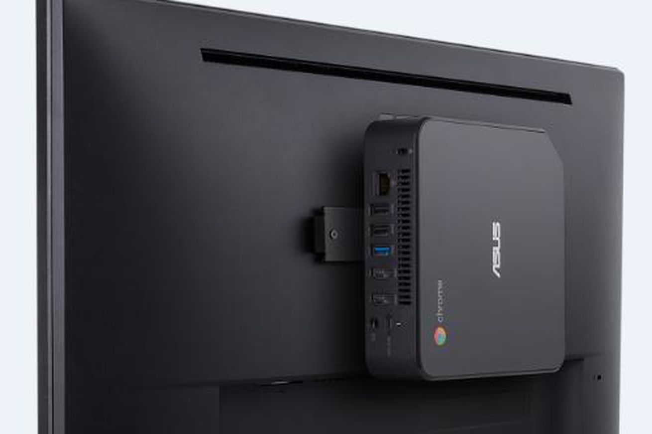 The Asus Chromebox 4 attached to the back of a desktop monitor.