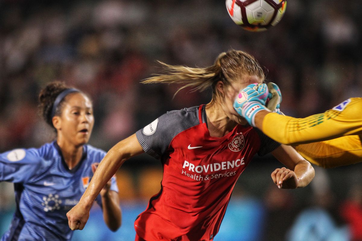 Emily Sonnett’s face running into Kailen Sheridan’s outstretched fists. 